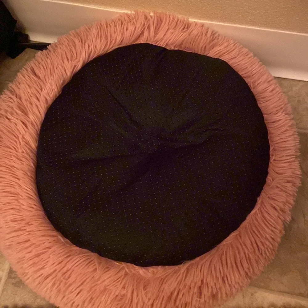 Pink dog/cat bed. Smaller breed.